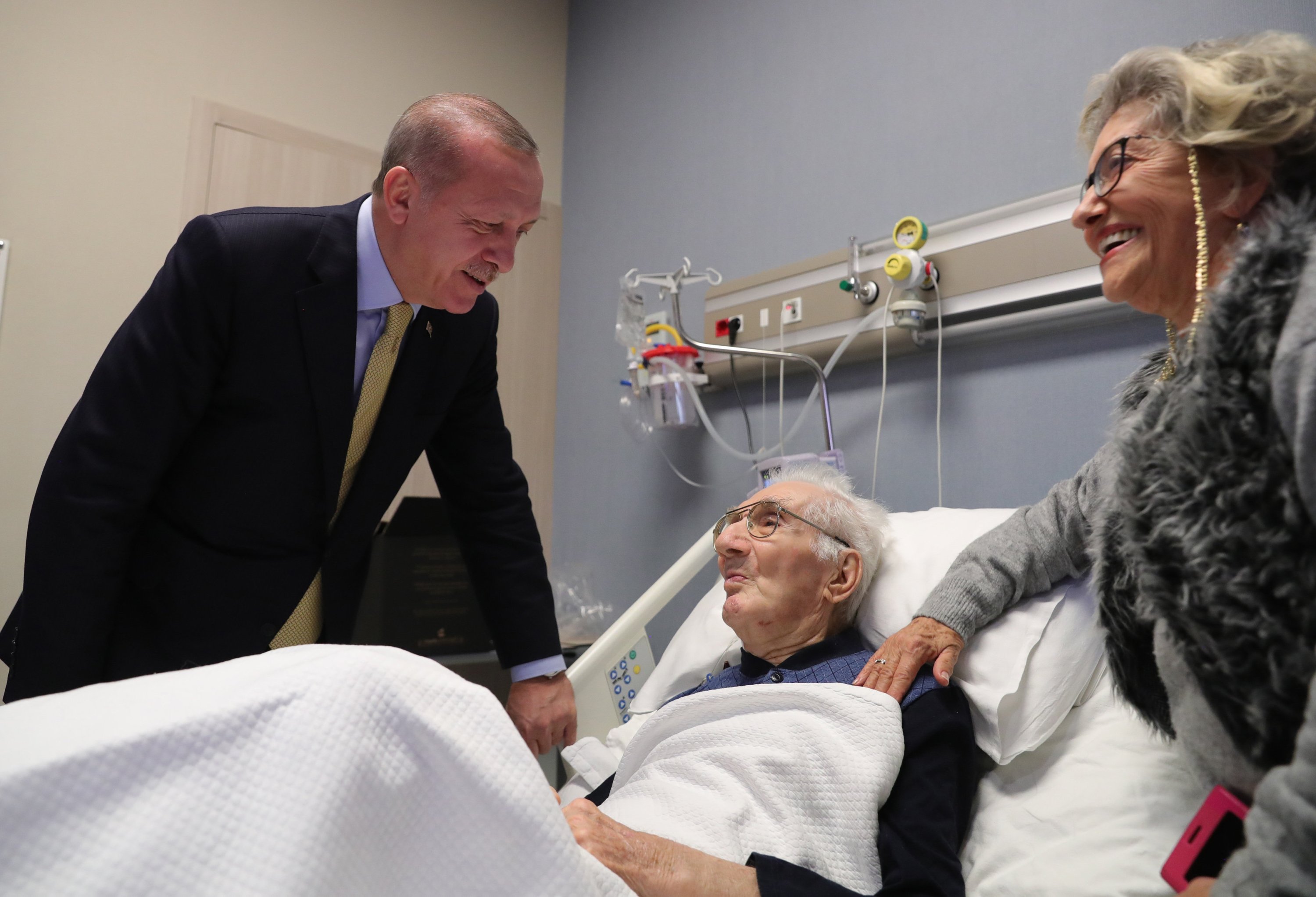 President Recep Tayyip Erdoğan is seen visiting veteran Turkish classical music composer and performer Alaeddin Yavaşca in hospital, Istanbul, Turkey, Dec. 9, 2019. (AA Photo)