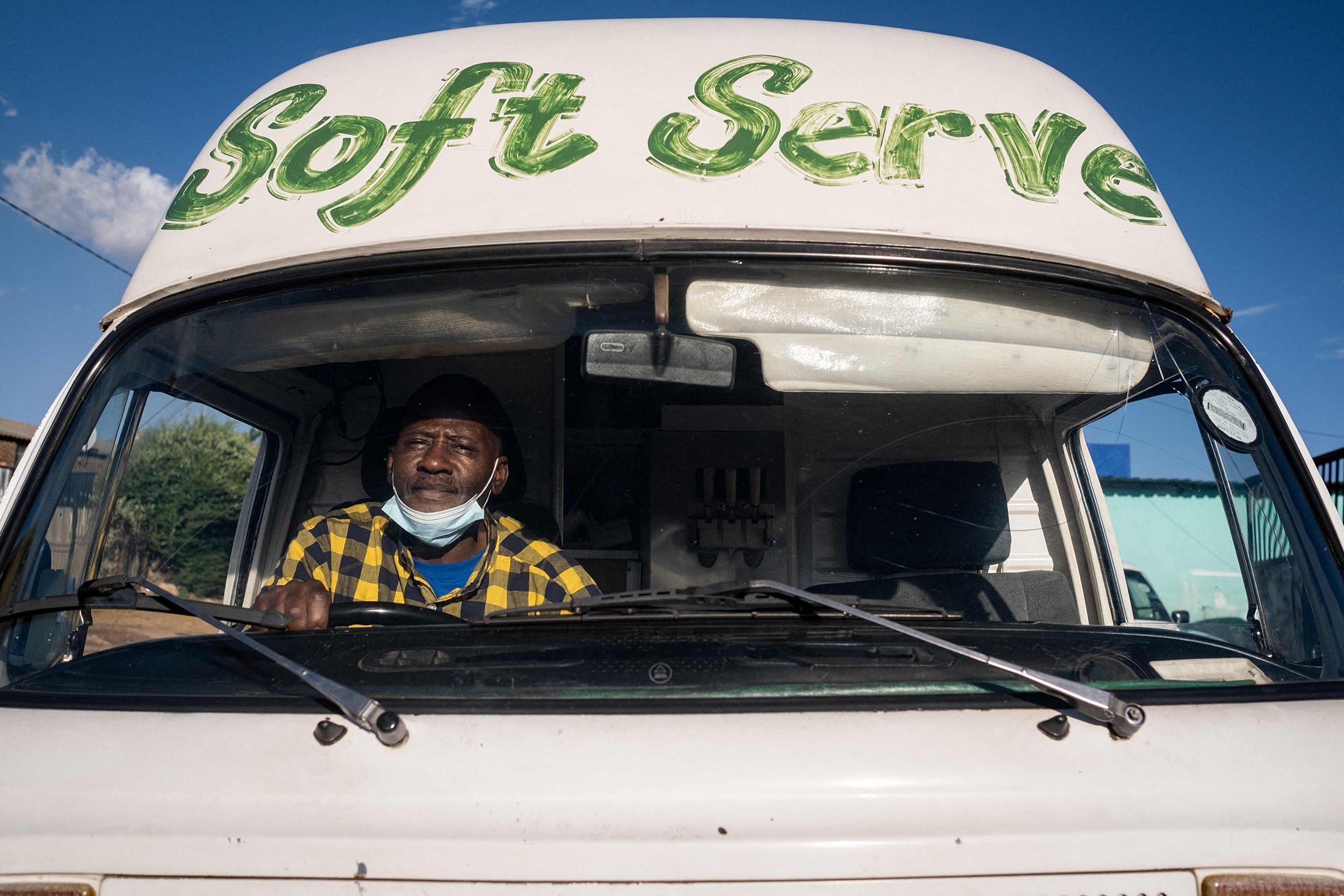 The owner of an ice cream truck, Sipho Mtshali, sits in his truck in Soweto, South Africa, Nov. 19, 2021. (AFP Photo)