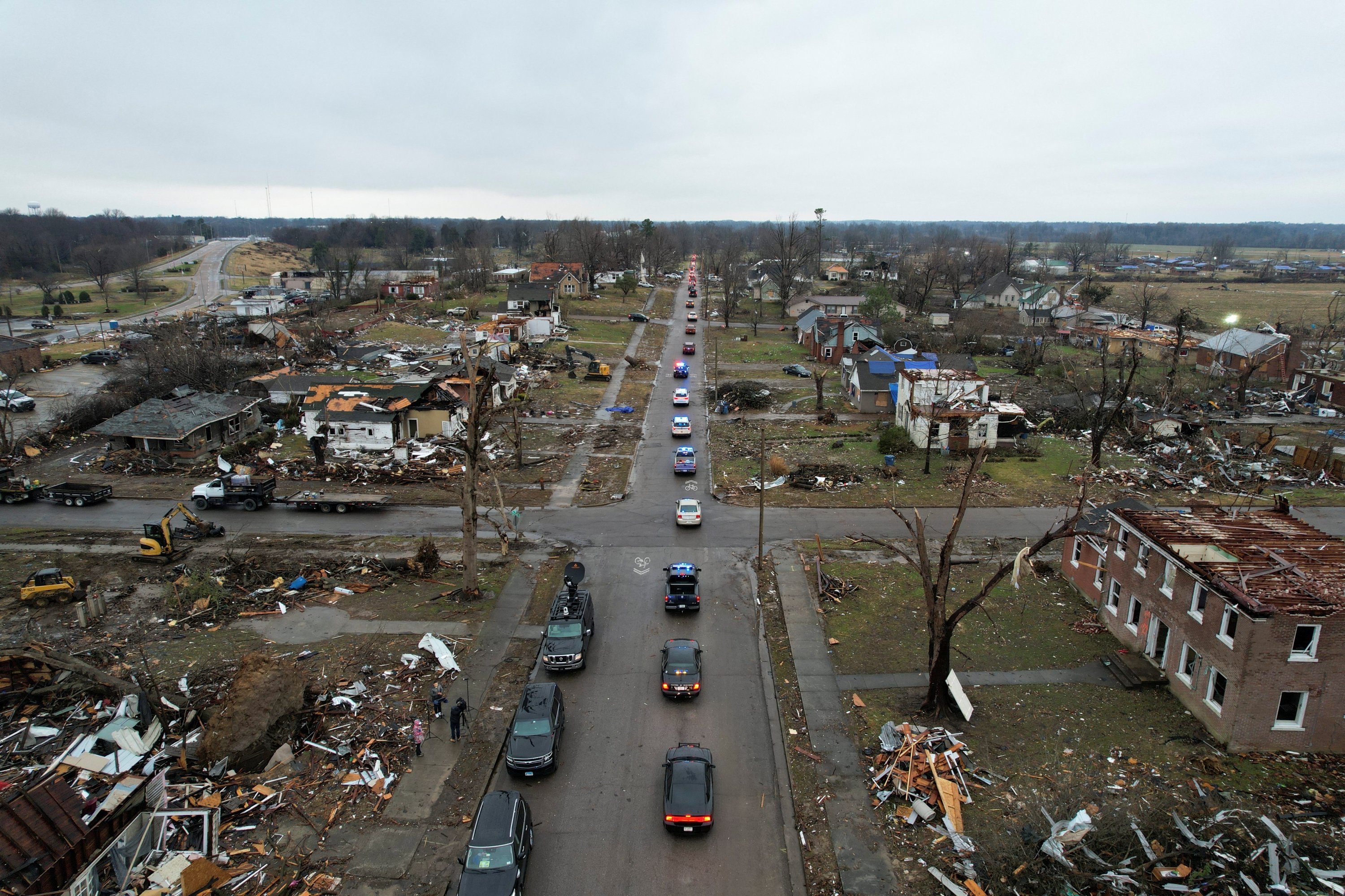 The funeral procession for corrections officer Robert Daniel passes a street lined with rubble and debris in Mayfield, Kentucky, U.S., Dec. 18, 2021.(Reuters Photo)