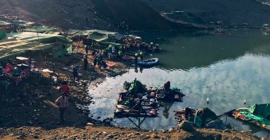 Rescue officials searching for missing people after a landslide at a jade mine in Hpakant, Kachin State, Myanmar, Dec. 22, 2021. (AFP Photo / Anonymous source)