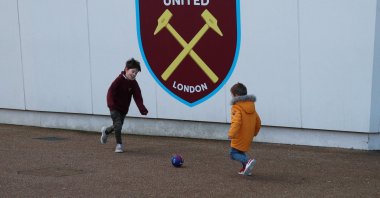 Children play football outside a stadium in London, U.K., Feb. 1, 2020. (Reuters Photo)