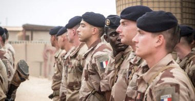 French soldiers from Operation Barkhane stand at attention as they wait for the handover ceremony of the Barkhane military base to the Malian army in Timbuktu, on Dec. 14, 2021. (AFP)