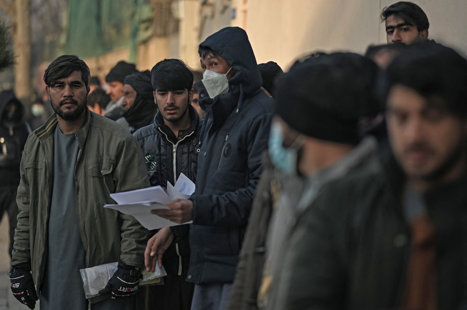 People queue to enter the passport office at a checkpoint in Kabul, Afghanistan, Dec. 19, 2021. (AFP Photo)