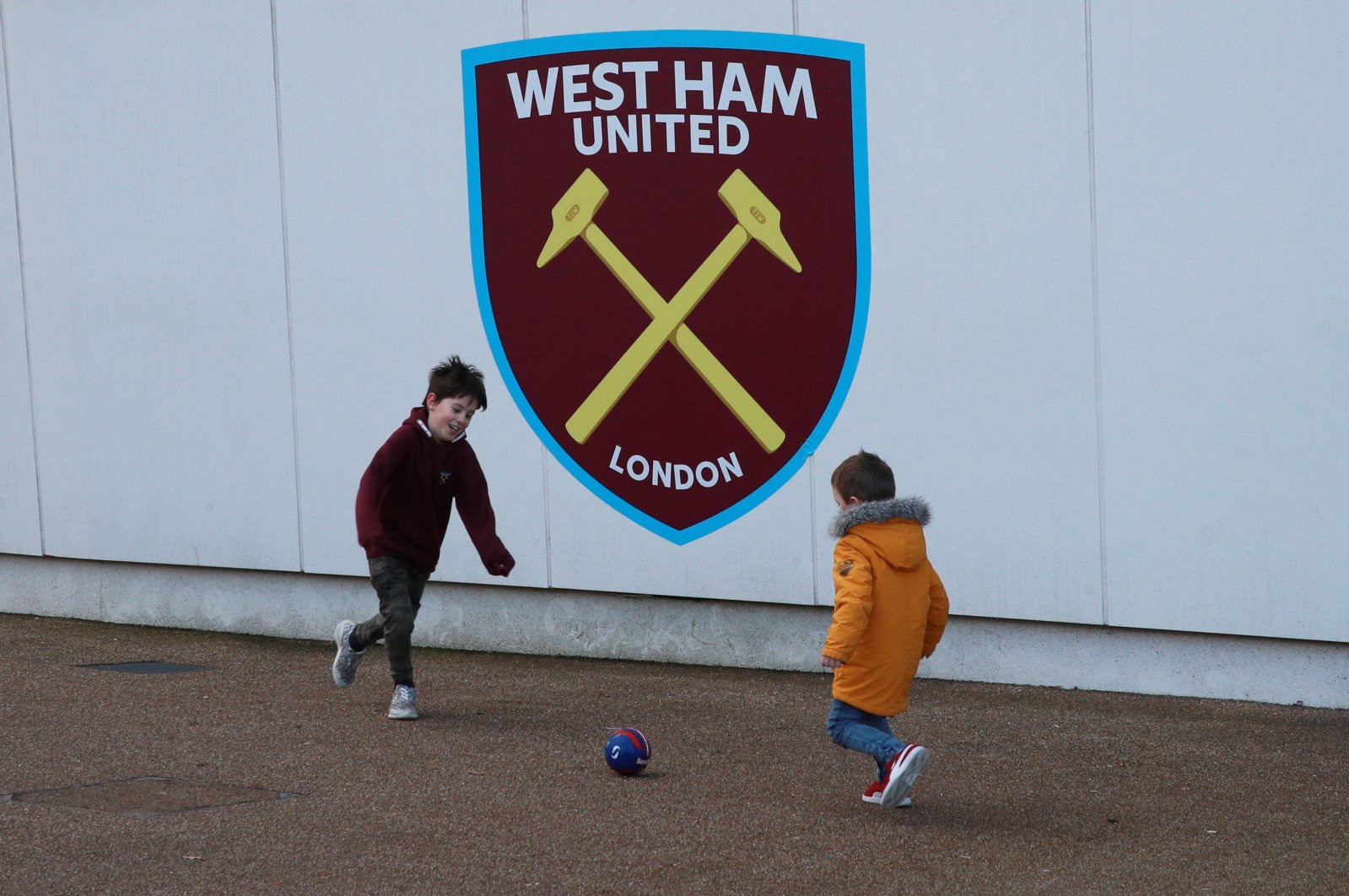 Children play football outside a stadium in London, U.K., Feb. 1, 2020. (Reuters Photo)