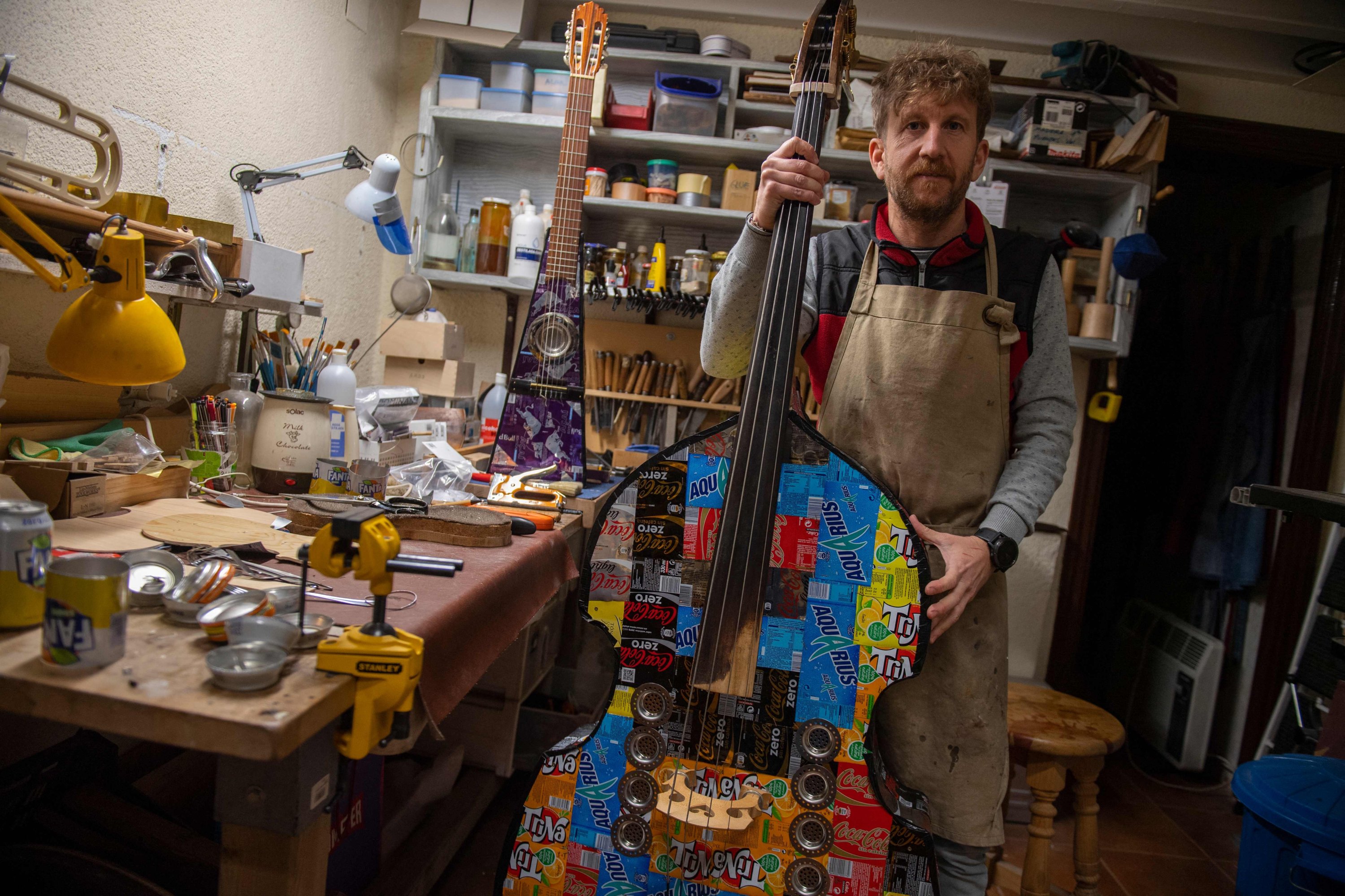 Spanish luthier Fernando Solar poses in his studio in Madrid, Spain, December 16, 2021 (AFP photo)