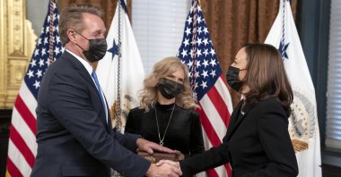 U.S. Vice President Kamala Harris (R) swears in Jeff Flake (L) as ambassador to Turkey as Cheryl Flake (C), spouse of Jeff Flake, looks on, in the Ceremonial Office at the White House in Washington, DC, USA, 10 December 2021. (EPA Photo)