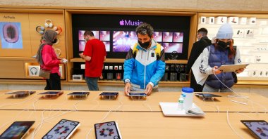 People browse products at an Apple store in Istanbul, Turkey, Nov. 24, 2021. (Reuters Photo)