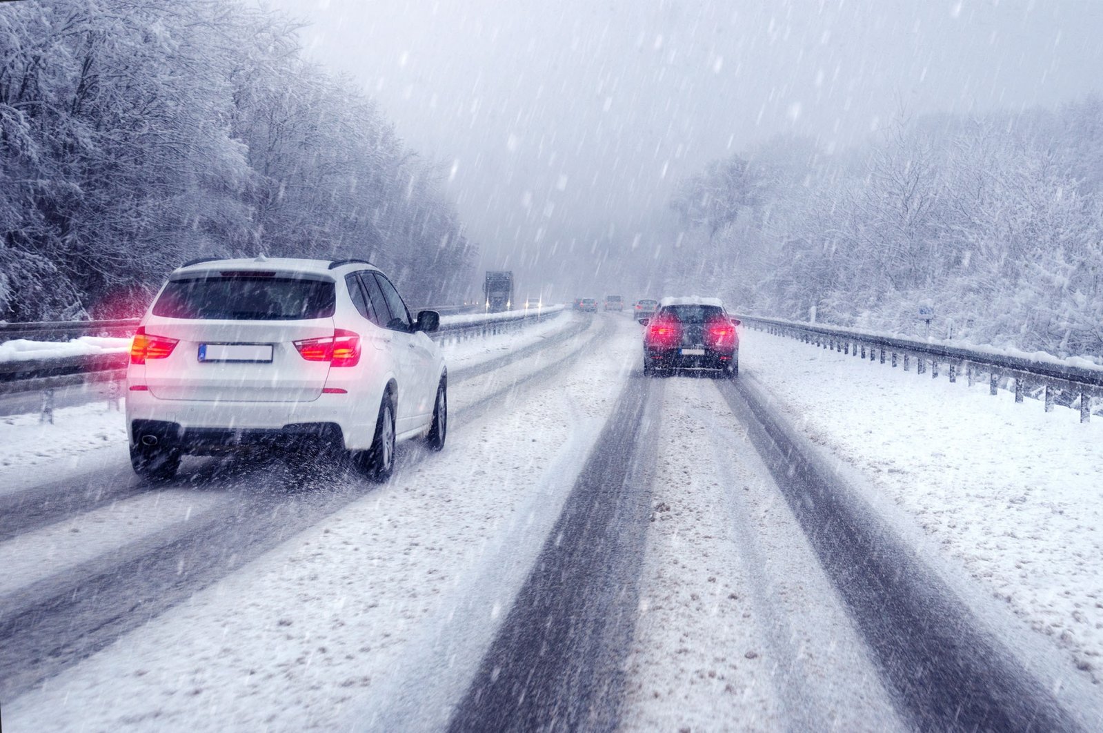 An SUV drives on a German highway amid snowfall. (Shutterstock Photo)