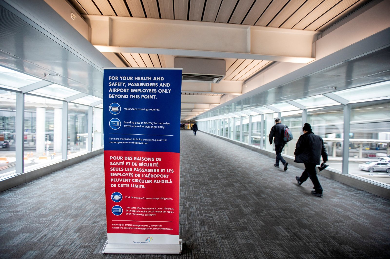 People walk toward Terminal 1 at Toronto&#039;s Pearson Airport after mandatory coronavirus testing took effect for international arrivals in Mississauga, Ontario, Canada, Feb. 15, 2021. (Reuters Photo)