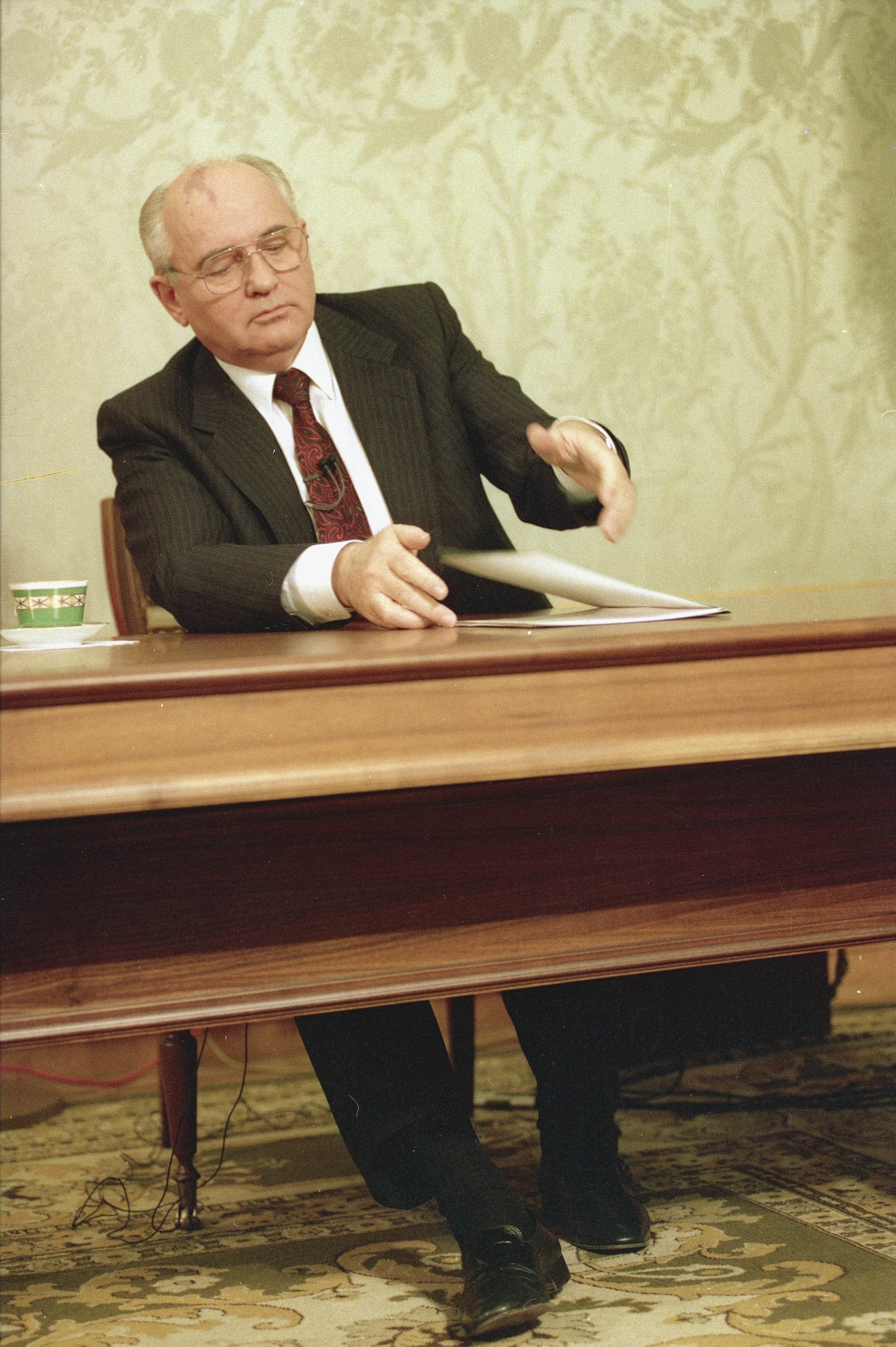 Mikhail Gorbachev, the eighth and final leader of the Soviet Union, closes his resignation speech on the table after delivering it on Soviet television in the Kremlin, Moscow, Wednesday, Dec. 25, 1991. It was a momentous event that ended an era 30 years ago. (AP Photo/Liu Heung Shing, File)