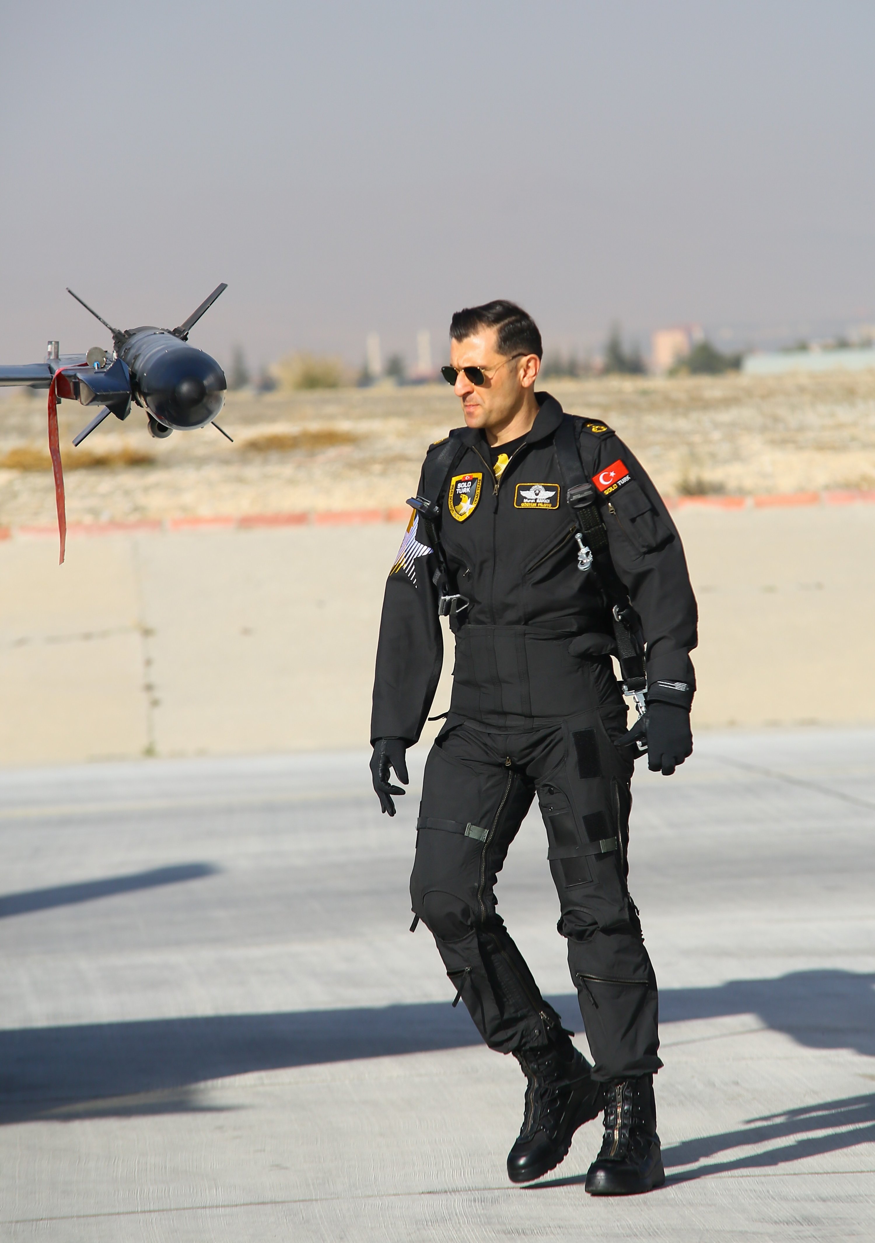 A member of SOLOTÜRK, the Turkish Air Forces Command's aerobatics team, on the tarmac, Ankara, Turkey, Dec. 25, 2021.