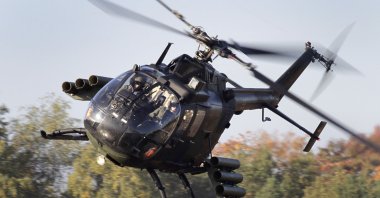 A BO105 anti-tank helicopter flies during a demonstration event held for the media by the German Bundeswehr in Munster near Hannover, Germany, Sept. 28, 2011. (AP Photo)
