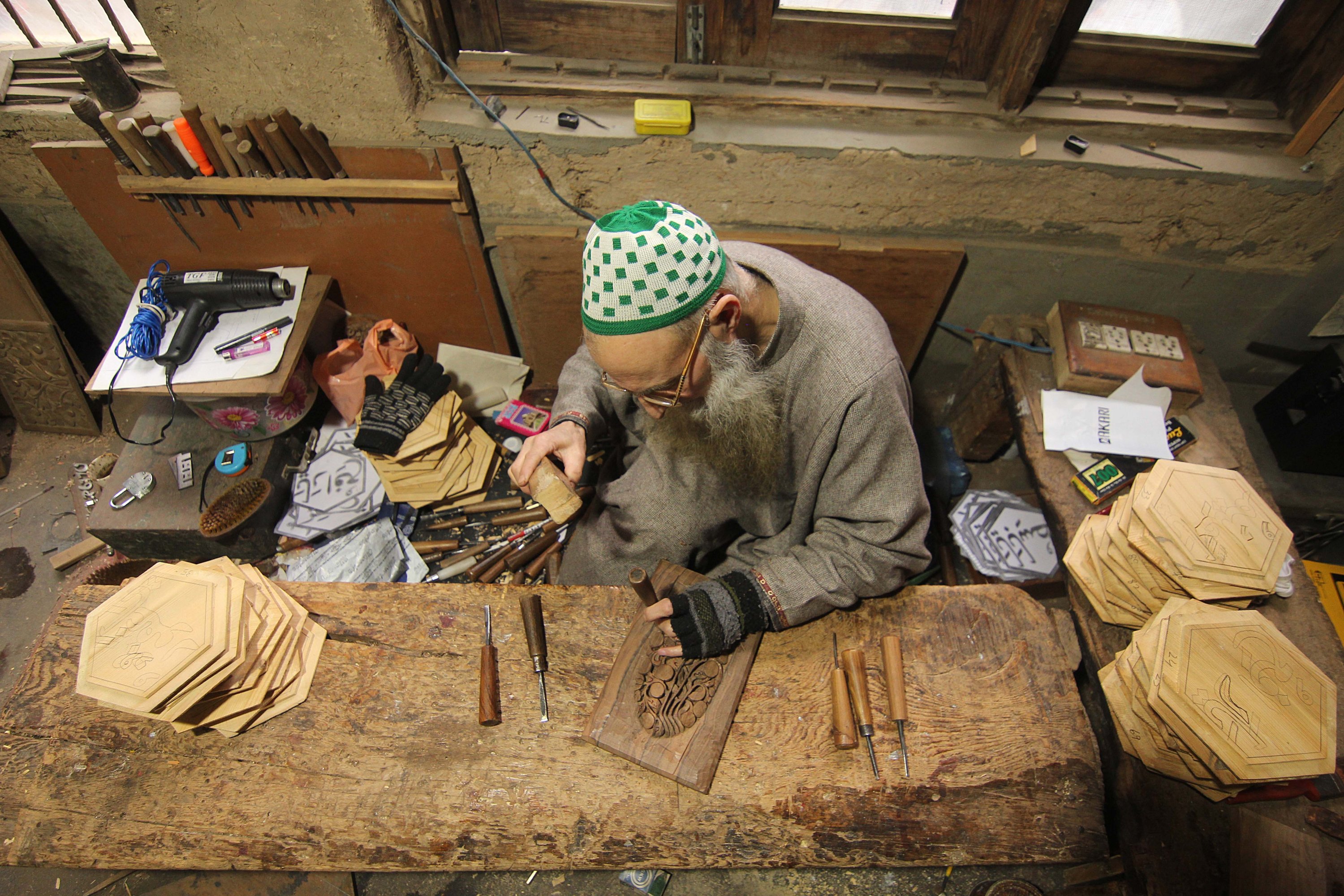 Craftsman Ghulam Nabi Dar carves wood in Kashmir, March 14, 2021. (AA) 
