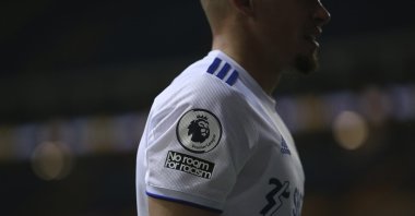 A Leeds United player features a &quot;No room for racism&quot; badge on his shirt, during a Premier League match against Wolves, Leeds, England, Oct. 19, 2020. (AP Photo)