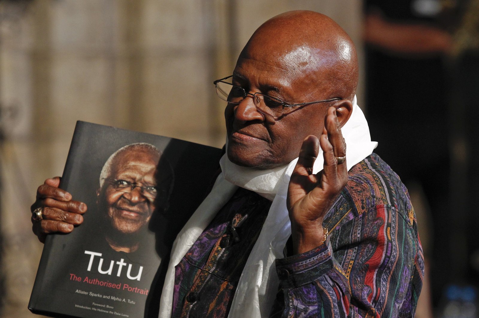 Former South African Archbishop Desmond Tutu poses with a copy of the book &#039;Tutu: The Authorised Portrait&#039; during an event for the book launch in Cape Town, South Africa, Oct. 6, 2011. (EPA Photo)