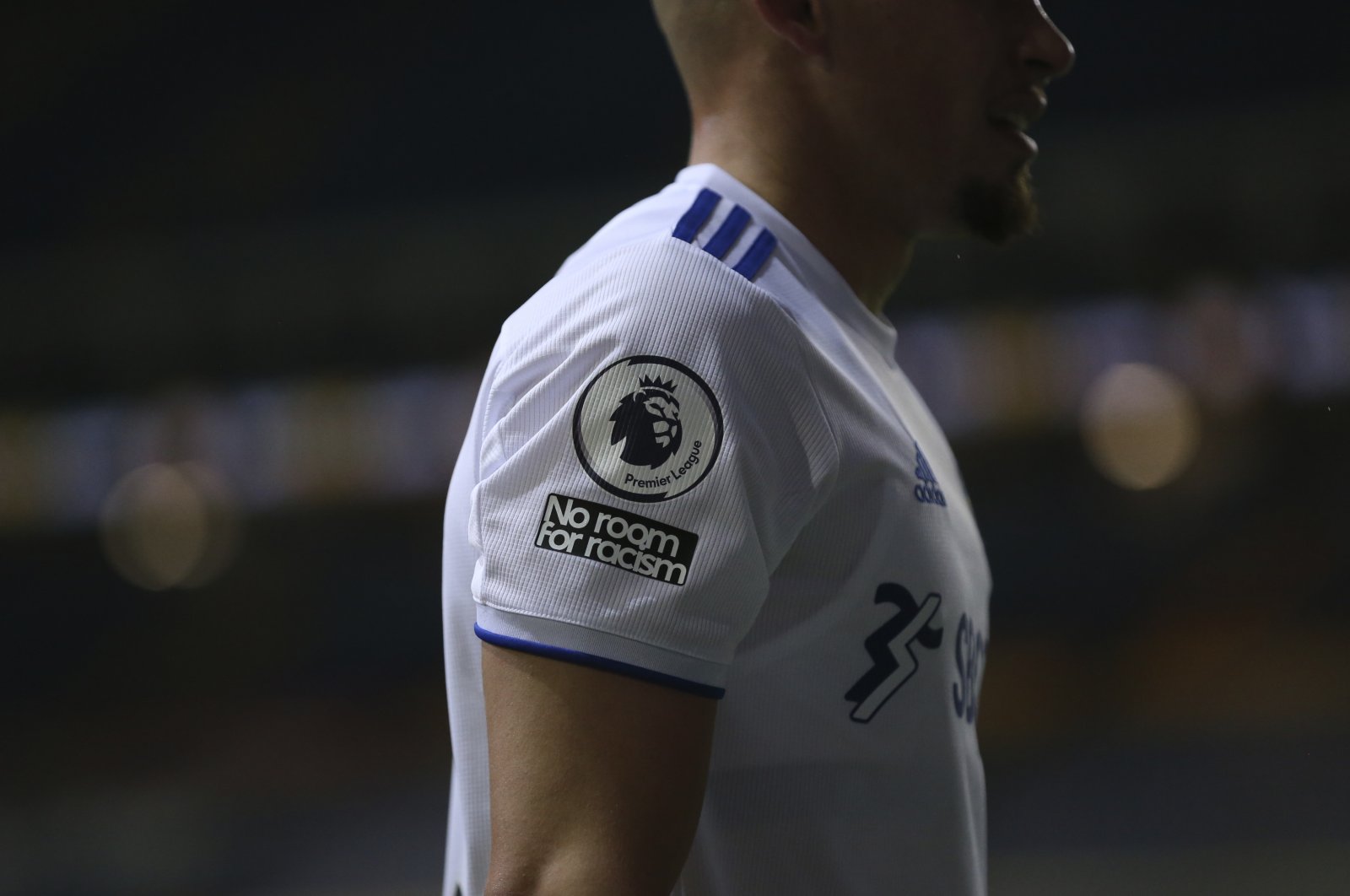 A Leeds United player features a &quot;No room for racism&quot; badge on his shirt, during a Premier League match against Wolves, Leeds, England, Oct. 19, 2020. (AP Photo)