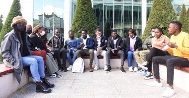 Tidie Traore (7th L) talks to international students at the campus of Hitit University in Çorum, central Turkey, Dec. 25, 2021. (AA PHOTO)