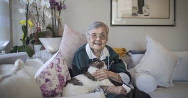 Sumerologist Muazzez Ilmiye Çığ, 108, poses with her cat at her home during an interview with Anadolu Agency, Mersin, southern Turkey, Dec. 24, 2021. (AA)