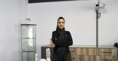 Selin Ariç, a member of the board of Doratek Medikal, stands behind of the body implants the company produce, Ankara, Turkey, Dec. 27, 2021. (AA Photo)