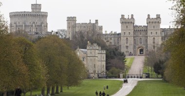 People walk along "The Long Walk" path outside Windsor Castle following the passing of Britain's Prince Philip, in Windsor, Britain, April 12, 2021. (EPA Photo)