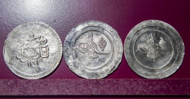 A close-up of three coins from the collection of Tunceli Museum, Tunceli, eastern Turkey, Dec. 26, 2021. (AA)