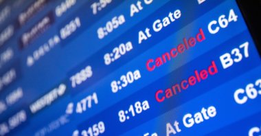 A screen showing canceled flights is seen at John F. Kennedy International Airport during the spread of the omicron coronavirus variant in Queens, New York City, U.S., Dec. 26, 2021. (Reuters Photo)