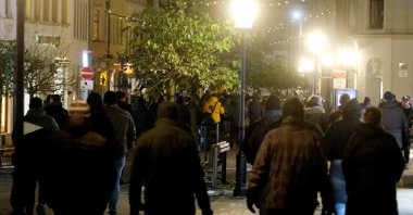 People protesting COVID-19 measures walk down a street in Germany&#039;s Freiburg, Dec. 27, 2021. (Reuters Photo)