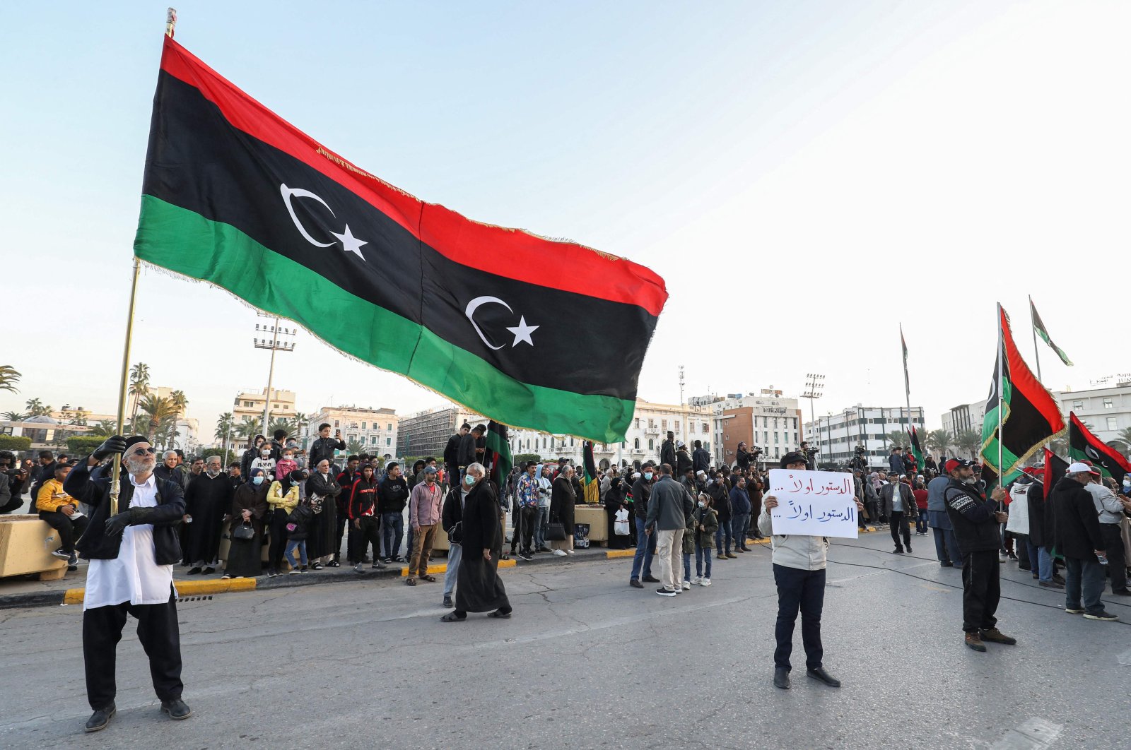 People gather with Libyan national flags at the Martyrs Square in the center of Libya&#039;s capital Tripoli to mark the country&#039;s 70th independence day, Dec. 24, 2021. (AFP File Photo)
