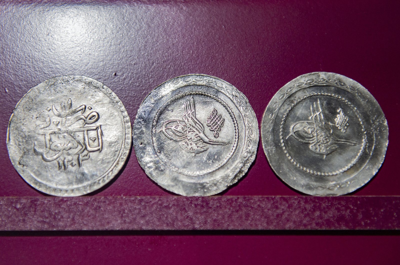 A close-up of three coins from the collection of Tunceli Museum, Tunceli, eastern Turkey, Dec. 26, 2021. (AA)