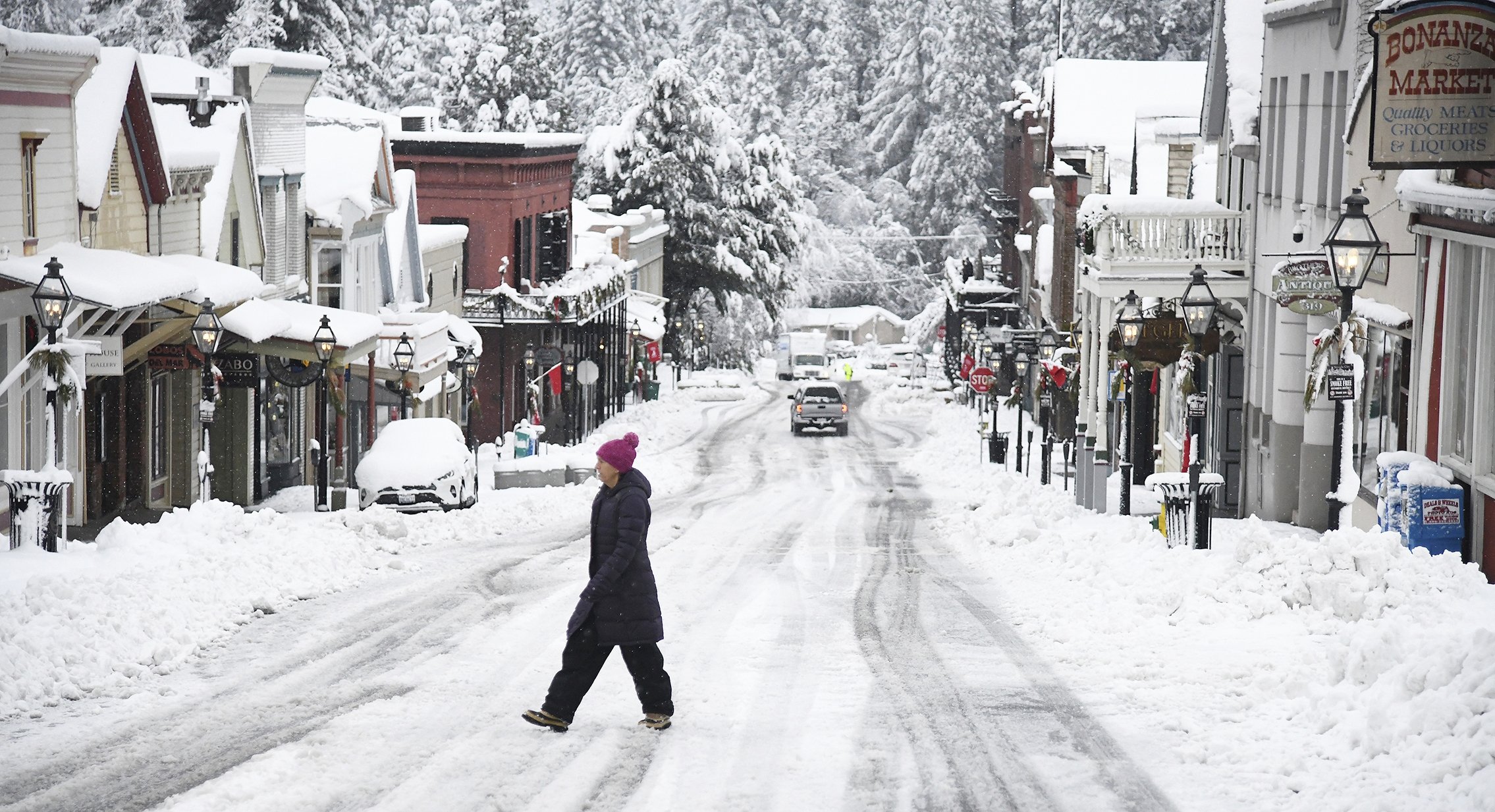 While snowfall was picturesque in places such as along Broad Street in Nevada City, California, it was dangerous for many others who were without electricity or stuck in the snow, U.S, Dec. 27, 2021. (AP Photo)