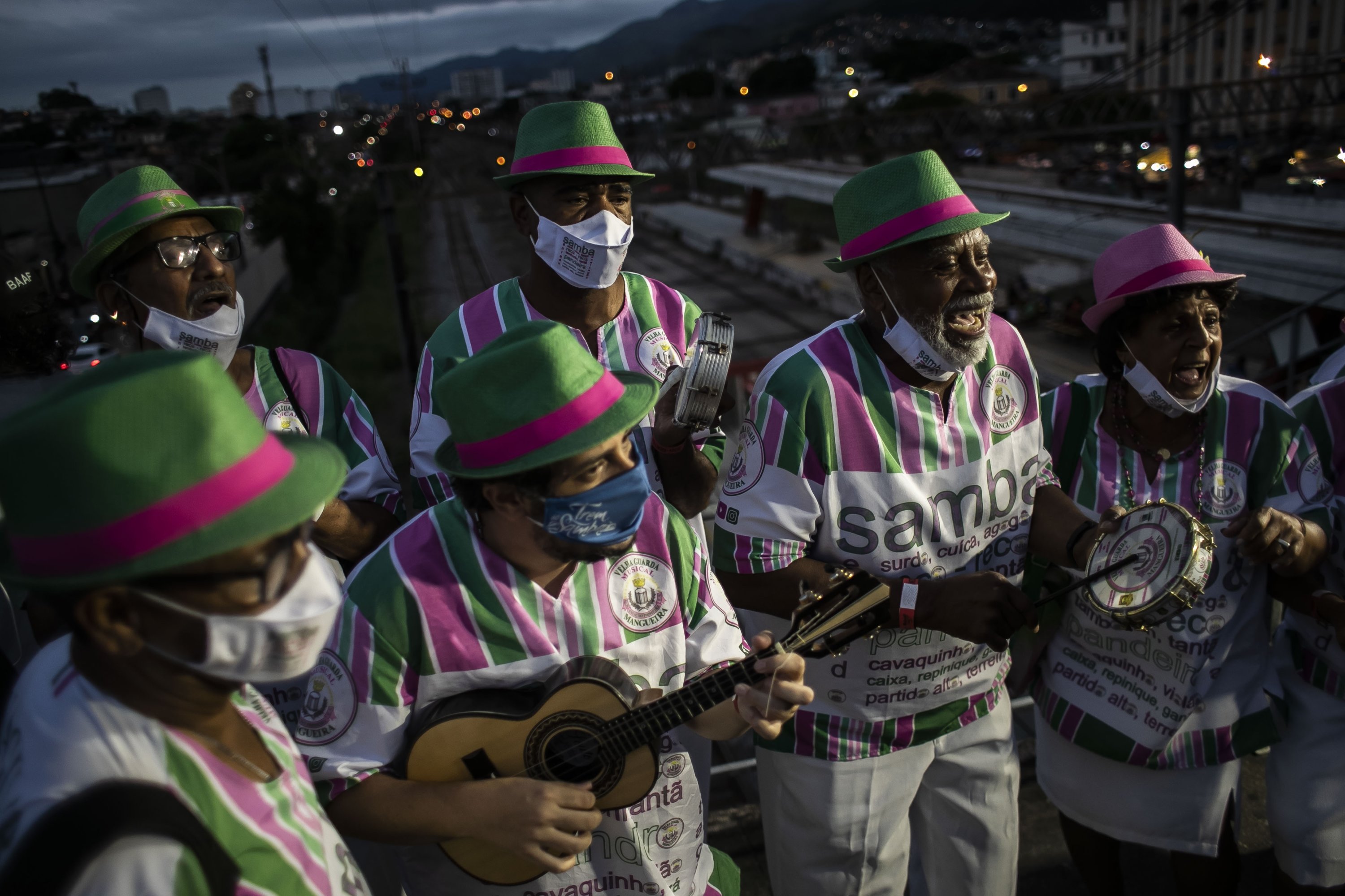 Members of the Mangueira samba school perform at the Oswaldo Cruz Station in Rio de Janeiro, Brazil, Dec. 4, 2021. (AP Photo)