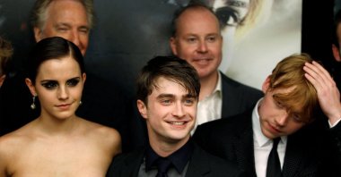 Cast members Rupert Grint (R), Daniel Radcliffe and Emma Watson (L) arrive for the premiere of the film &quot;Harry Potter and the Deathly Hallows: Part 2&quot; in New York, July 11, 2011.  (REUTERS)