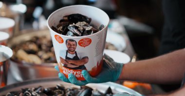 Midyeci Ahmet's stuffed mussels are served on the counter, Istanbul, Turkey, Dec. 21, 2021. (AA Photo)