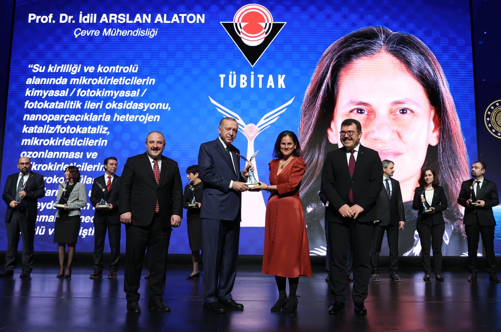 President Recep Tayyip Erdoğan hands out an award to Professor İdil Arslan Alaton at the ceremony in the capital Ankara, Turkey, Dec. 28, 2021. (AA PHOTO)