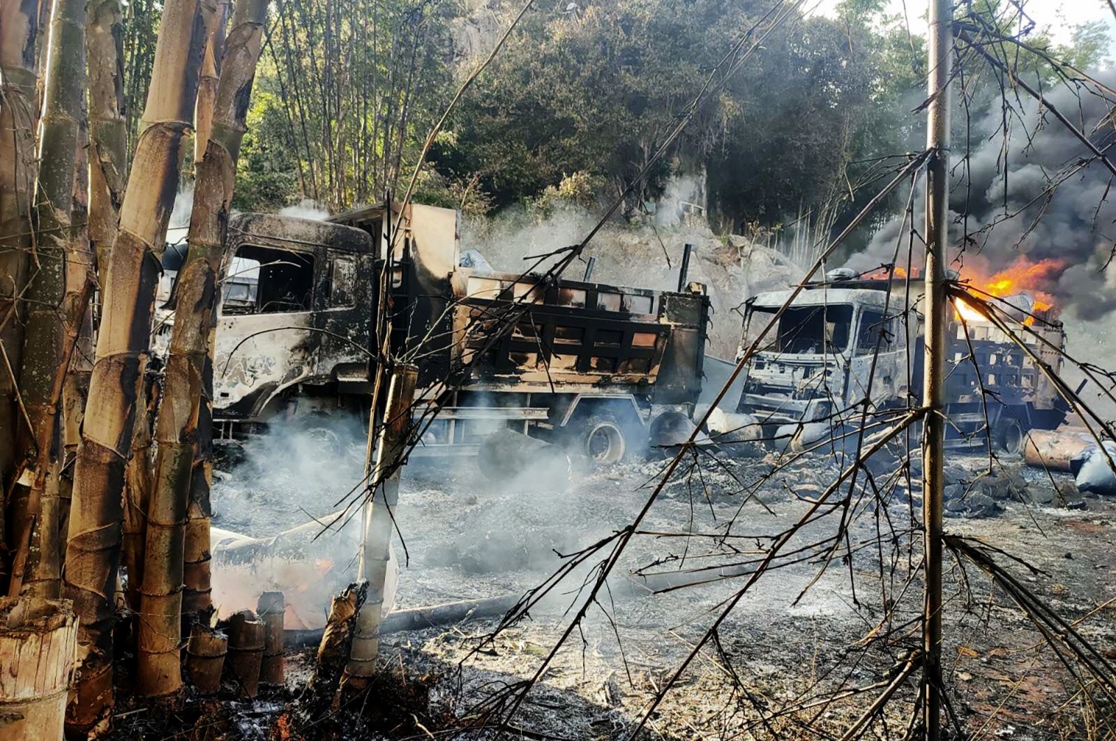 Smoke and flames billow from vehicles in Hpruso township, Kayah state, Myanmar, Dec. 24, 2021. (Karenni Nationalities Defense Force via AP)