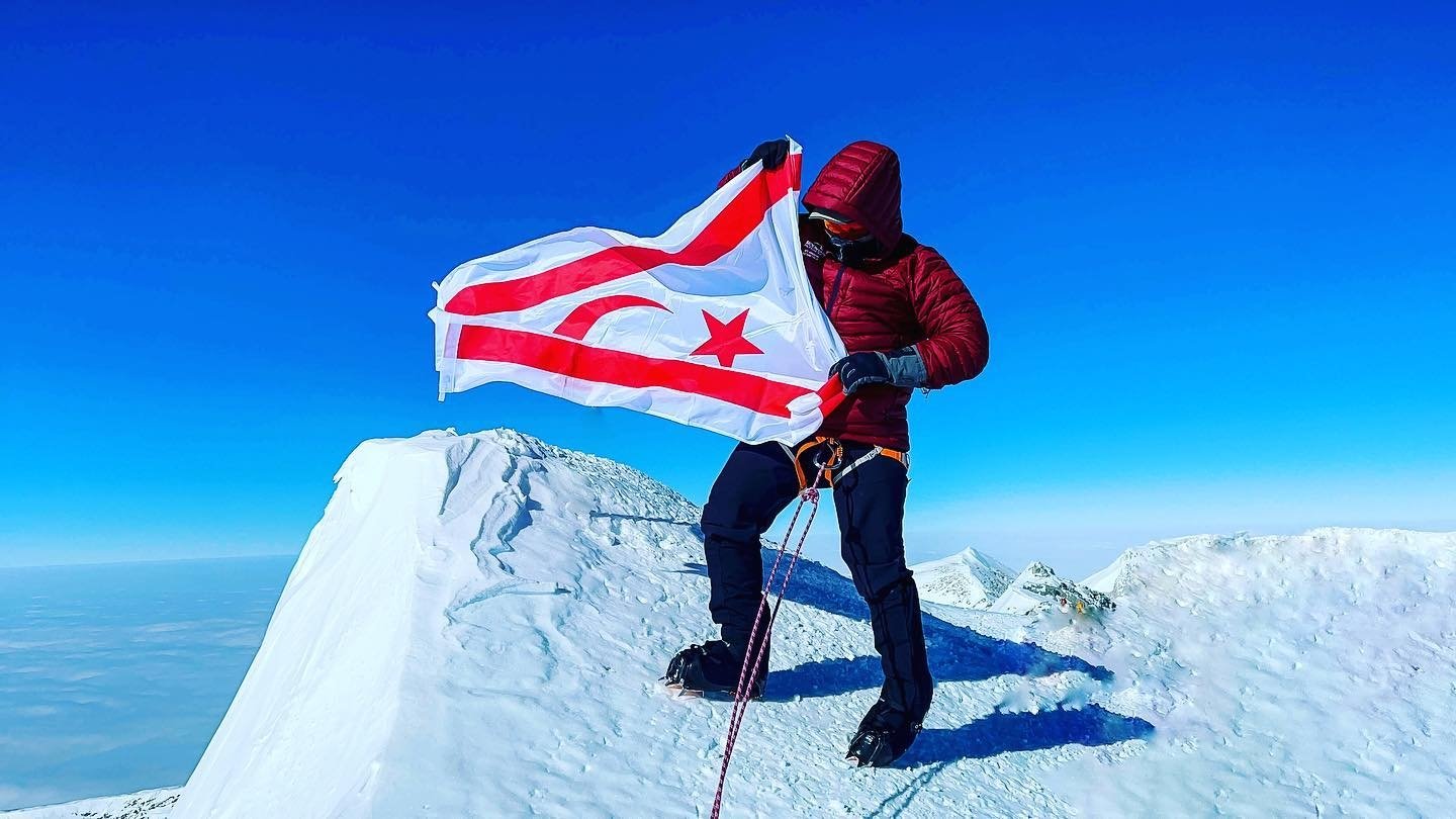 Turkish Republic of Northern Cyprus (TRNC) citizen Birkan Uzun waves the Turkish Cypriot flag from atop Mt. Vinson, the highest peak in Antarctica. (AA)