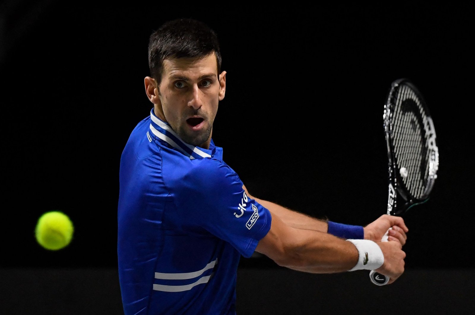 Serbia&#039;s Novak Djokovic hits a return during the Davis Cup semifinal, Madrid, Spain, Dec. 3, 2021. (AFP Photo)