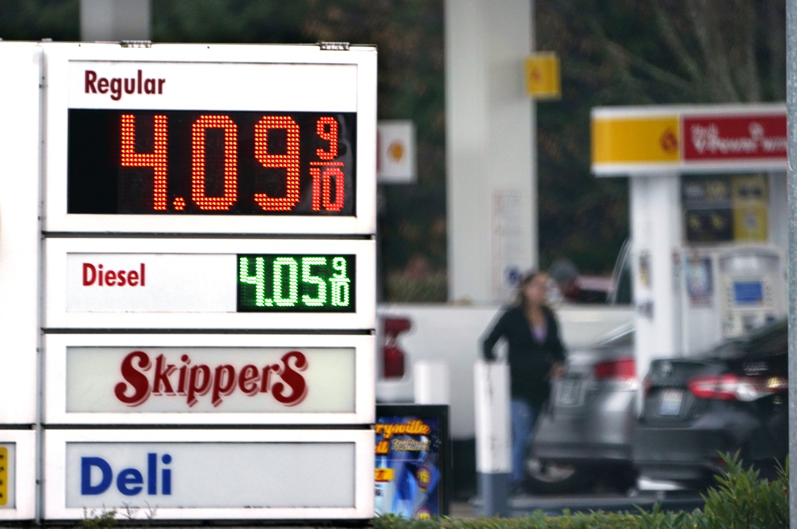 A driver fills a tank at a gas station in Marysville, Washington, U.S., Dec. 10, 2021. (AP Photo)