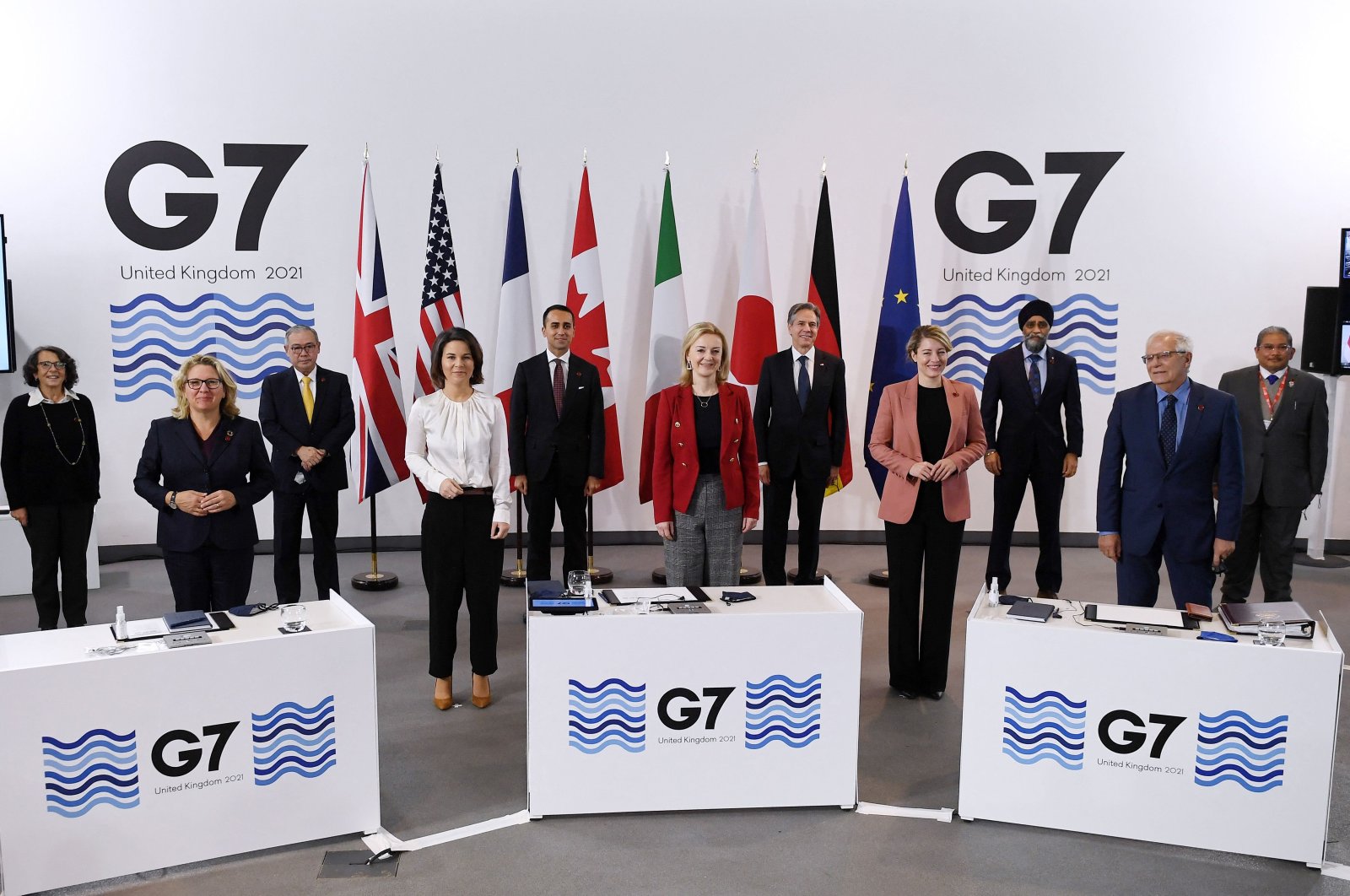 Participants pose for a group photo during the G-7 summit of foreign and development ministers on the final day of the summit in Liverpool, England, Dec. 12, 2021. (AFP Photo)