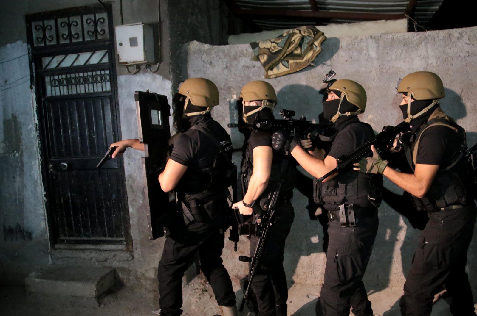 Counterterrorism police prepare to raid a home in Adana province, Turkey, Sept. 29, 2021. (AA File Photo)
