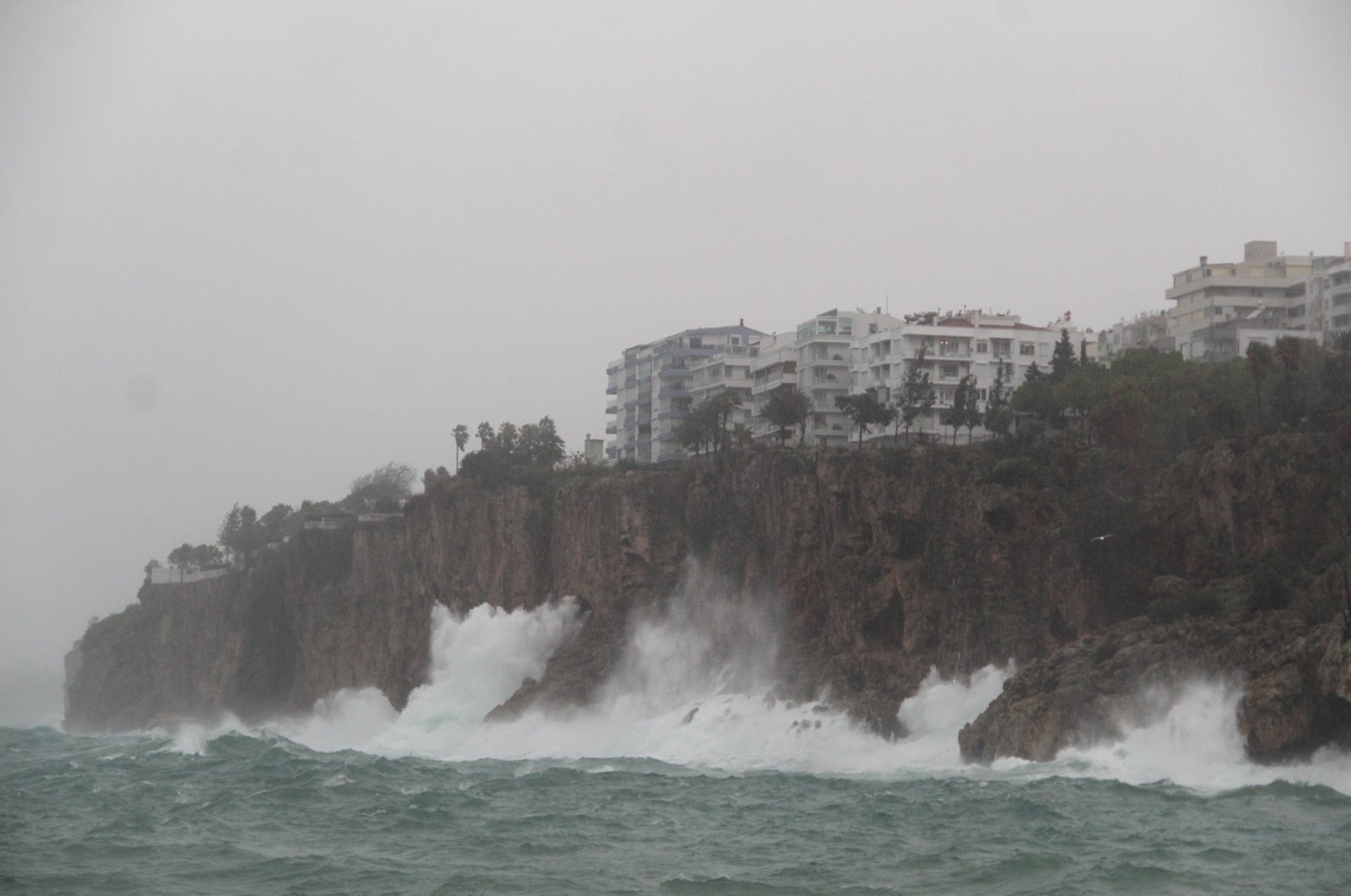 Waves crash into the cliffs of downtown Antalya during a storm, in southern Turkey, Dec. 30, 2021. (IHA Photo)