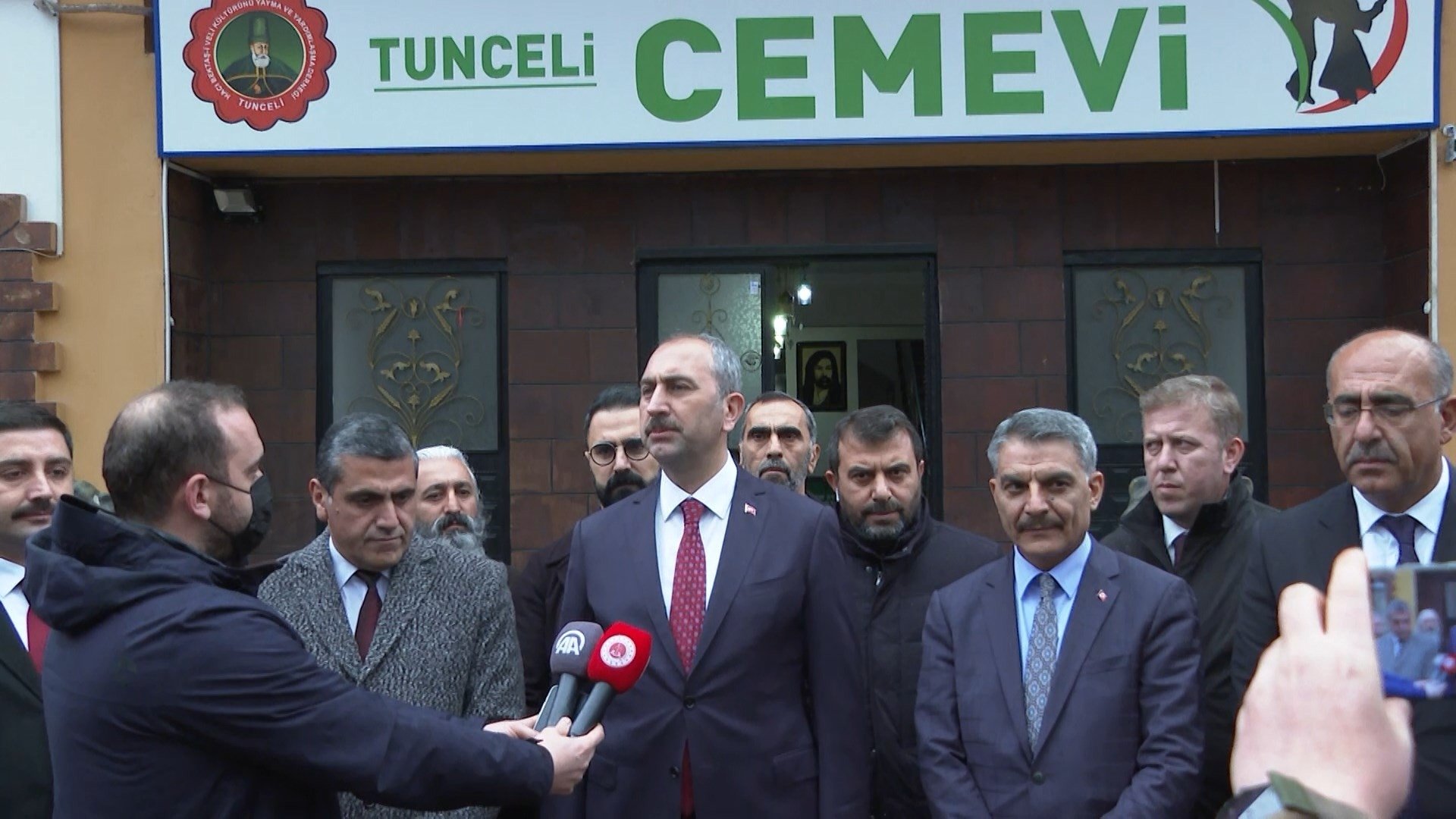 Justice Minister Abdulhamit Gül (C) speaks to reporters during a visit to the Tunceli Cemevi in Tunceli, Turkey, Dec. 18, 2021. (IHA Photo)