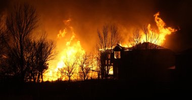 Homes burn as wildfires rip through a development, Dec. 30, 2021, in Superior, Colo. (AP Photo)
