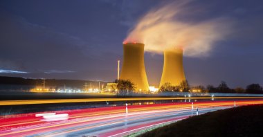 Steam rises from the cooling towers of the Grohnde nuclear power plant near Grohnde, Germany, Dec. 29, 2021. (AP Photo)