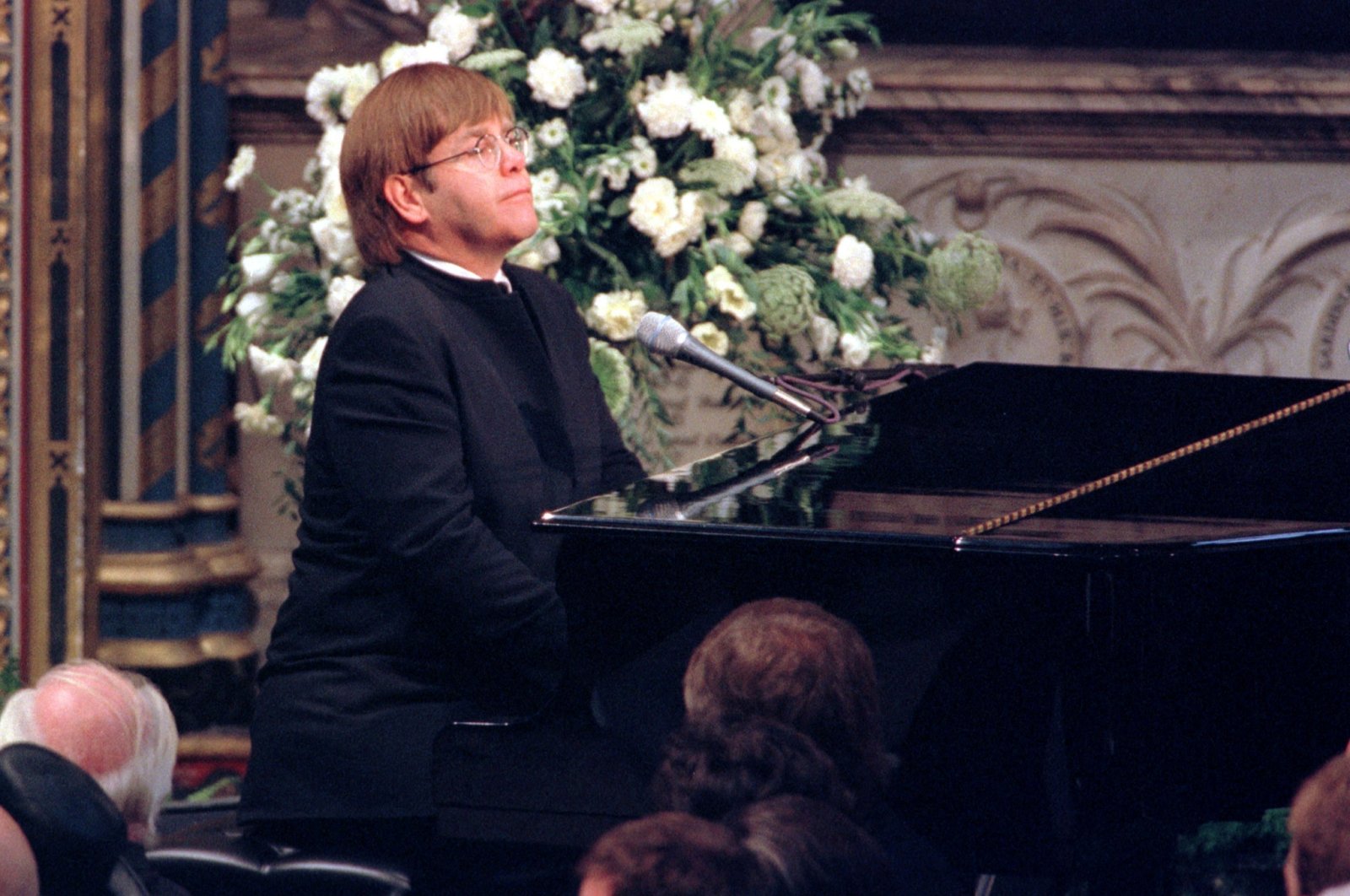 Pop singer Elton John plays a specially re-written version of his classic &quot;Candle in the Wind&quot; during the funeral service for Diana, Princess of Wales, at Westminster Abbey, Sept. 6, 1997. (REUTERS)