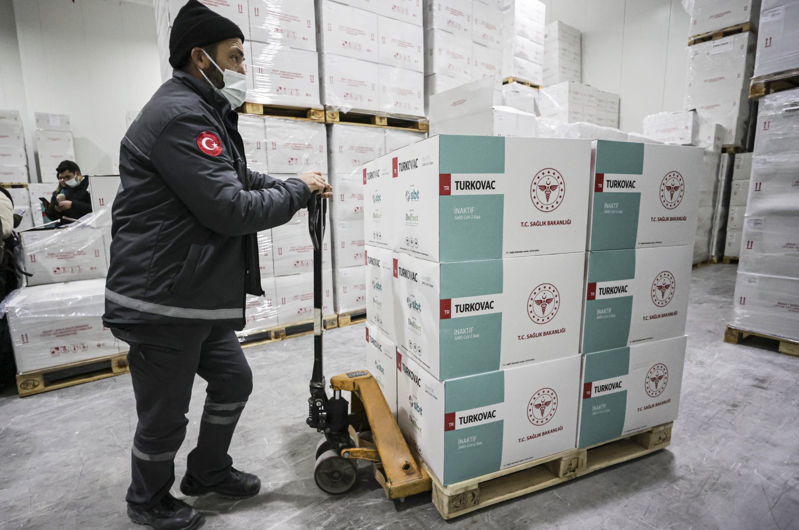 A worker carries boxes of Turkovac, Turkey&#039;s first locally made COVID-19 vaccine at a warehouse in the capital Ankara, Turkey, Dec. 27, 2021. (AA PHOTO)