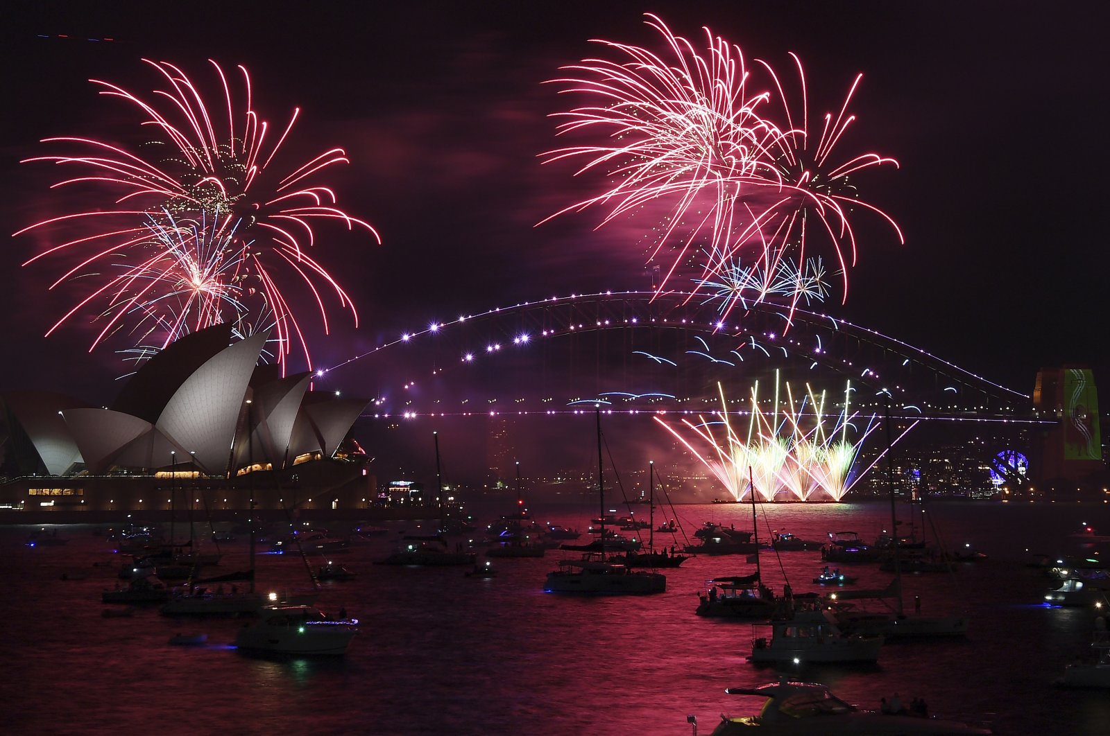 Fireworks over the Sydney Opera House and Harbour Bridge as New Year&#039;s Eve celebrations begin in Sydney, Australia, Dec. 31, 2021. (AP Photo)