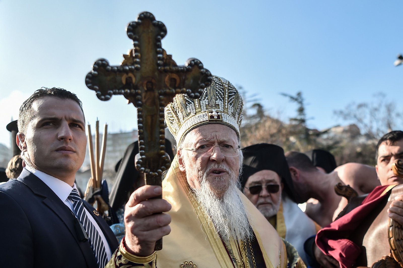 Patriarch Bartholomew I holds a wooden cross during Epiphany celebrations, in Istanbul, Turkey, Jan. 6, 2018. (AFP Photo)