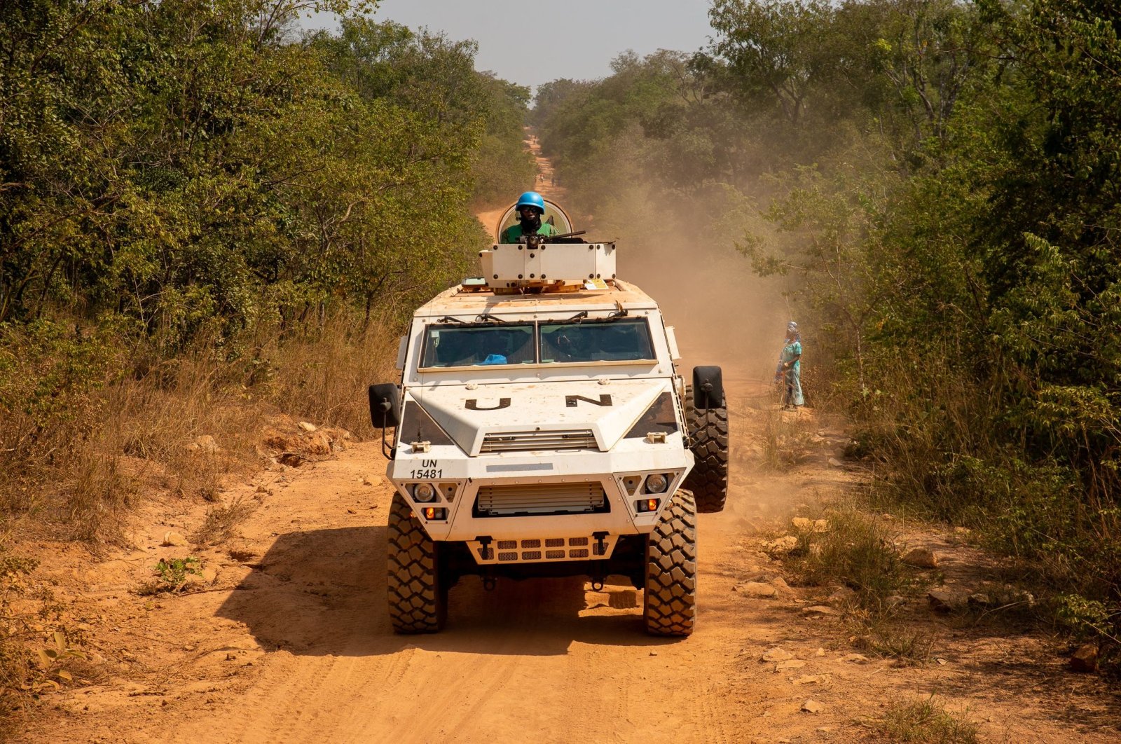 A United Nations armored personnel carrier patrols on a supposedly safe road, avoiding roads with possible explosive devices on them, in Paoua, Central African Republic, on Dec. 5, 2021. (Photo by Barbara DEBOUT / AFP)