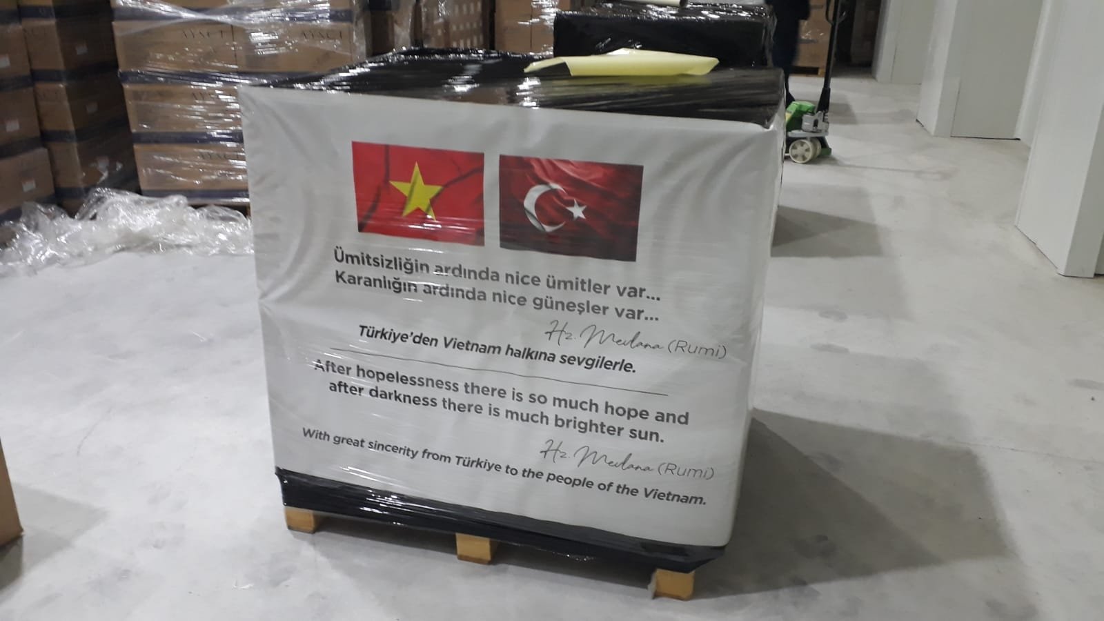 A view of aid packages adorned with Turkish and Vietnamese flags and with a quote of famed Sufi mystic Rumi, at the airport, in Istanbul, Turkey, Jan. 2, 2022. (AA PHOTO)